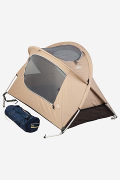 NOMAD children's cotton travel cot in sand color with storage bag.