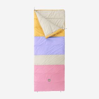 NOMAD Blazer Multicolor sleeping bag in dark pink with yellow, purple, beige and pink color blocks on display