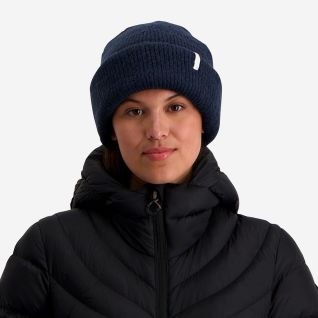 NOMAD Turoa women's dark blue knitted beanie with a label on the cuff.