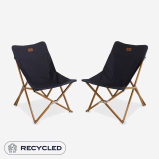 Set of two NOMAD Mando Lounge chairs with dark blue upholstery and wooden frames.