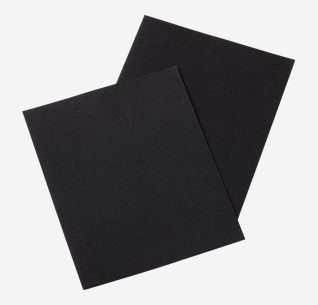 Two black NOMAD repair patches for sleeping mats stacked on a white background.