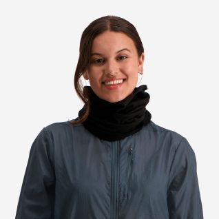 NOMAD black tube scarf worn around the neck by a woman wearing a blue outdoor jacket