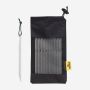 NOMAD set of 10 16 cm aluminum tent pegs in a black storage bag with a yellow label