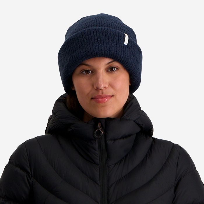 NOMAD Turoa women's dark blue knitted beanie with a label on the cuff.