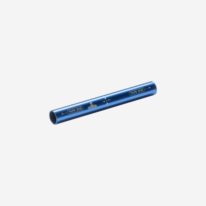 NOMAD aluminum tent pole repair tube in dark blue with instructions printed on the tube.