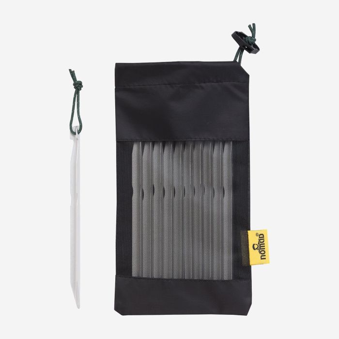 NOMAD set of 10 16 cm aluminum tent pegs in a black storage bag with a yellow label
