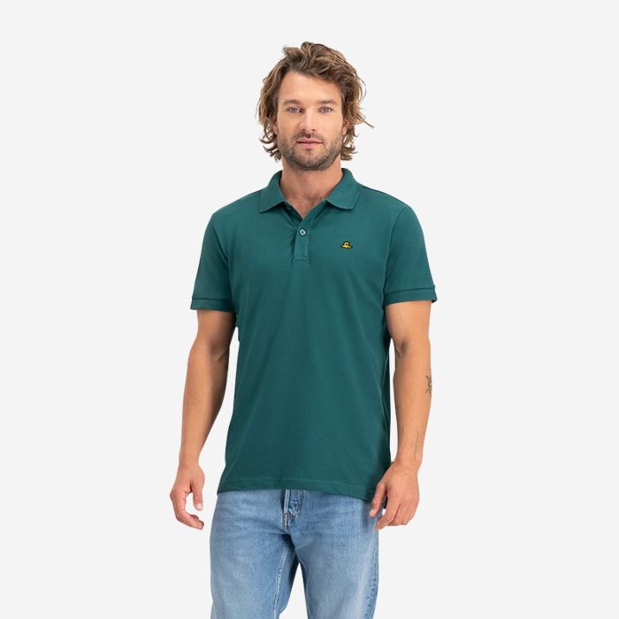 NOMAD heren polo piqué in donker groen met korte mouwen en kraag getoond op model