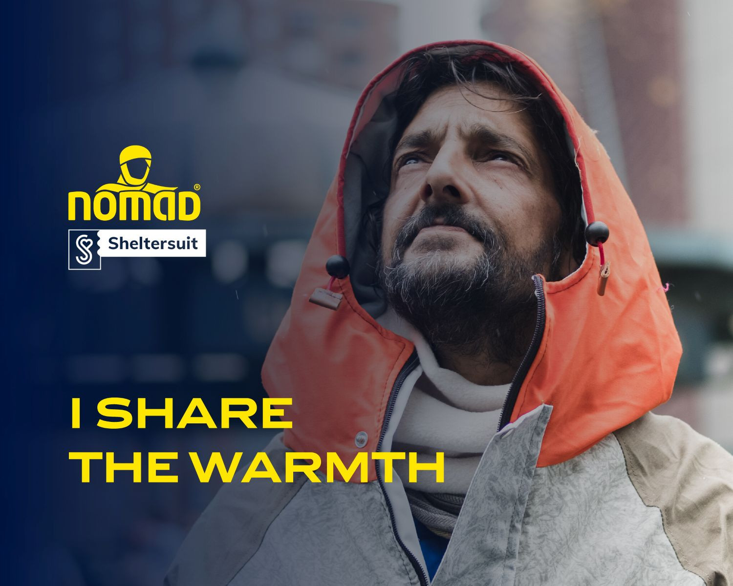 Man standing outside in rain, wearing warm jacket from collaboration between NOMAD and Sheltersuit